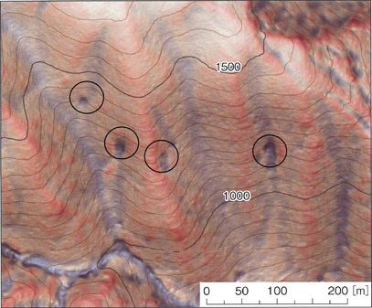 An example of dented land where water gushes out during a heavy rainfall</figcaption>